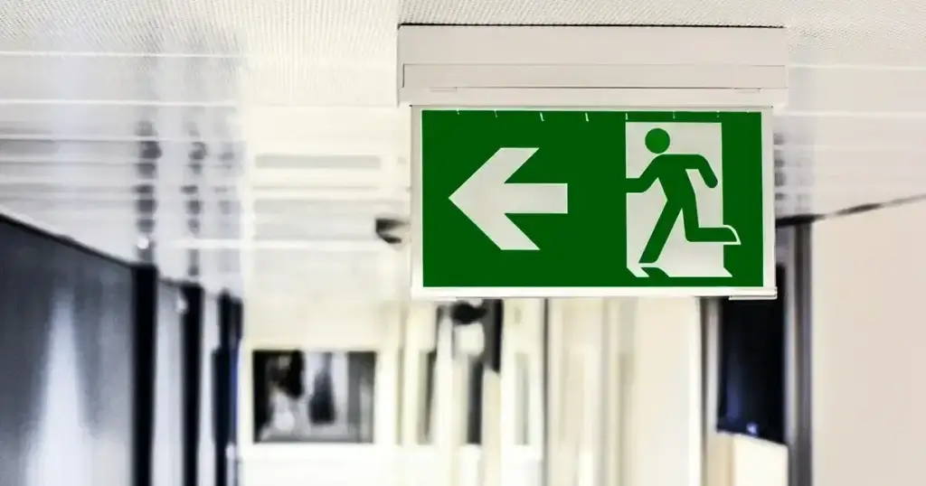 Emergency exit signage on ceiling school